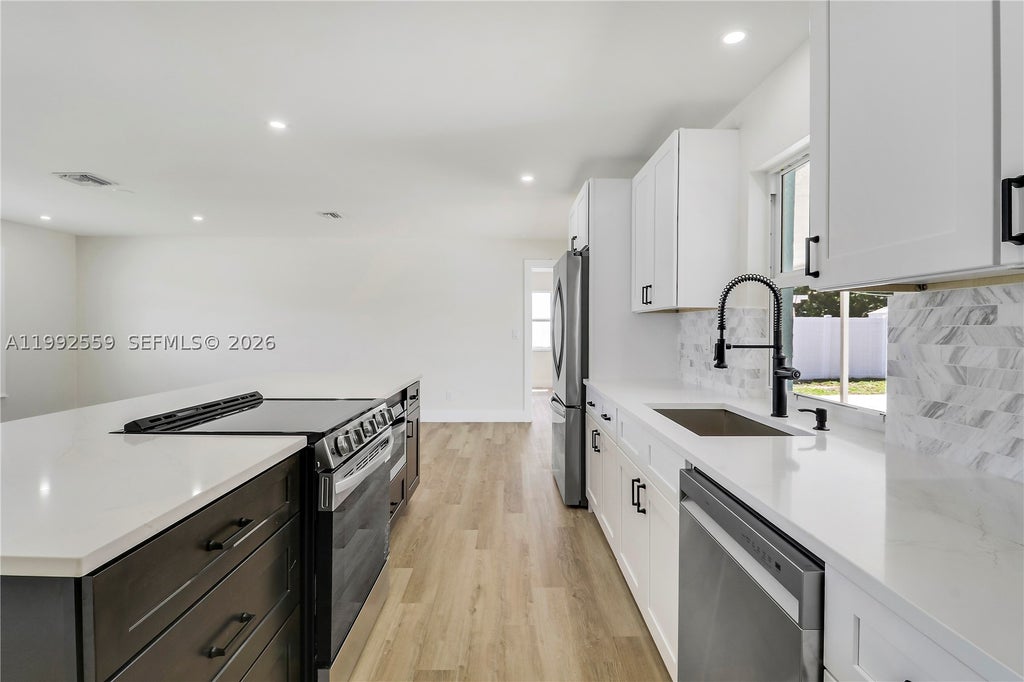 Photo of 404 Highwood Circle, Jupiter, FL 33458 (MLS # A11992559)