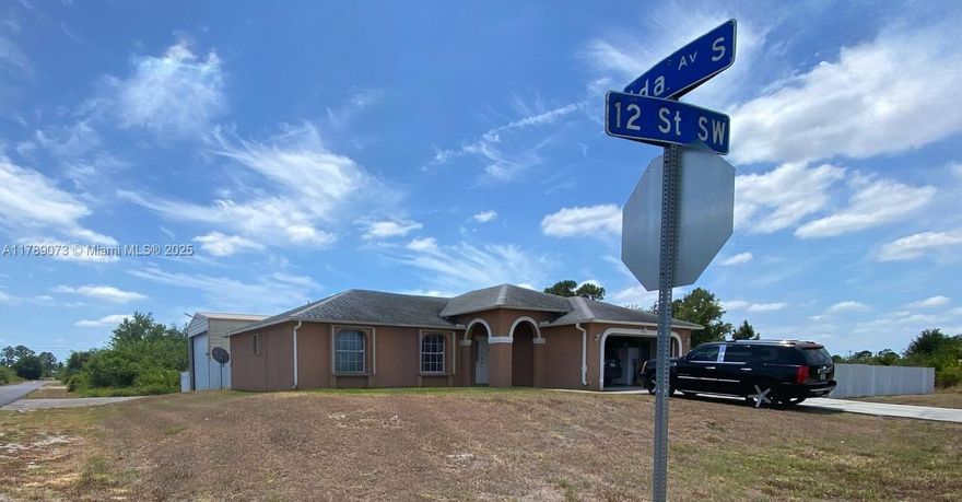 Unique Opportunity for Truck Drivers! This property features a corner lot with half an acre of land and a spacious warehouse perfect for storing your work truck. The home boasts 2,624 square feet under air conditioning, showcasing beautiful Spanish porcelain tile flooring. The AC was newly installed just 3 years ago and comes with a 10-year warranty. Additionally, the house has hurricane shutters throughout for added protection. Located in a quiet, excellent neighborhood, this is the perfect place to live. Don't miss this rare chance to buy your dream home.