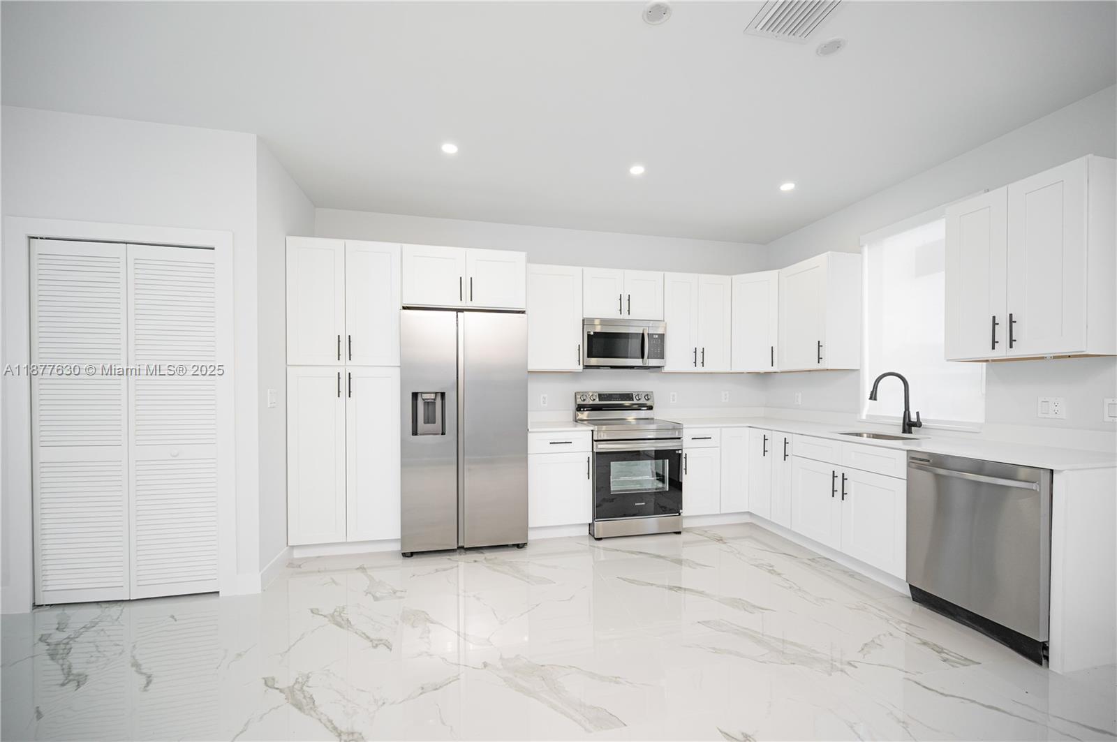 Brand new top of the line modern 3-bedroom, 3 full-bath home featuring stylish finishes and a functional open-concept layout. The kitchen comes fully equipped with brand-new appliances, seamlessly connecting to spacious living and dining areas—perfect for families or entertaining guests. Enjoy the convenience of a private driveway with parking for two vehicles. No HOA application required, making for a hassle-free purchase and greater flexibility for the new owner. Situated in a rapidly growing area of South Florida, with easy access to major highways, shopping centers, and schools. Move-in ready—ideal as a primary residence or a smart investment opportunity.