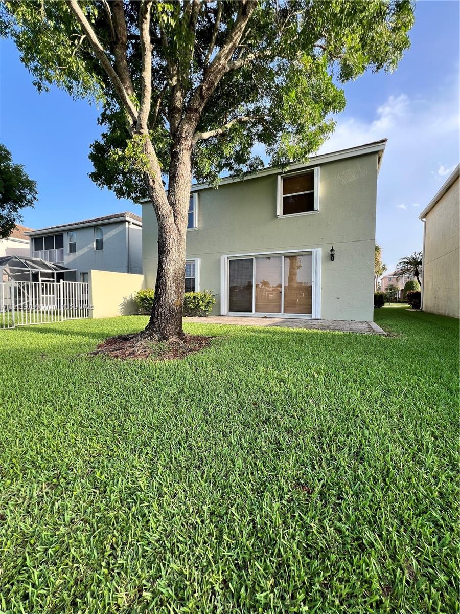 Photo of 136 Hamilton Ter, Royal Palm Beach, FL 33414 (MLS # A11818902)