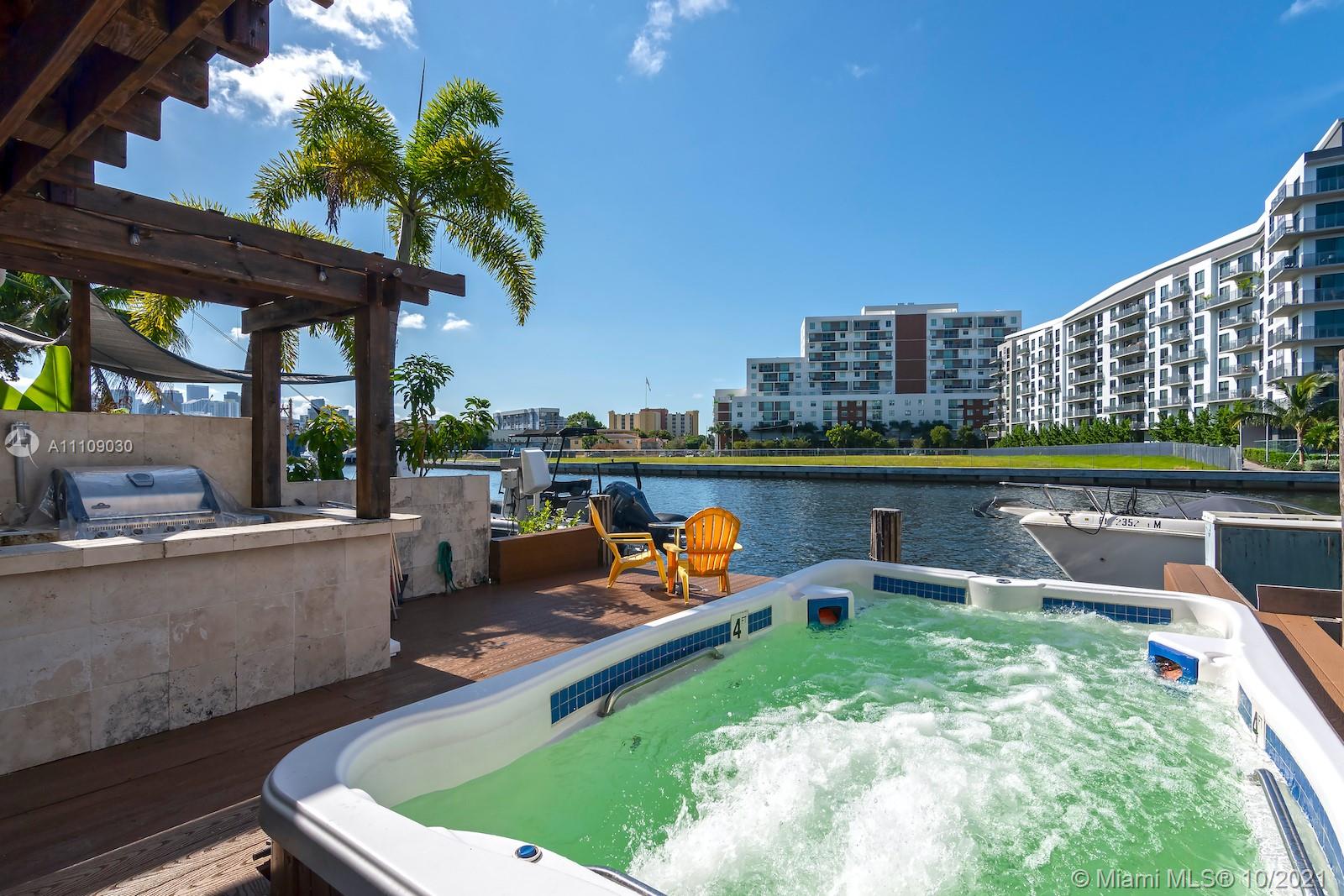 Contemporary, Key West style, fully renovated 4 BD/4BA/1HB waterfront home on the Miami River with direct ocean access. This 3 story highly energy efficient house has impact doors & windows. 1st floor w/ huge living room w/ a completely open concept from the entrance foyer to the river-side terrace. Endless pool/spa & large entertainment area outside. 2nd fl has 3BD+TV room w/ volume ceilings and a lot of closet space. Master BD has his and hers bathrooms w/ a balcony overlooking the river. The front bedroom has a stairway w/ a large up to below bed space. The 3rd floor has a BD, BA, den + storage. Arrive home by boat, car, train or bike. Parking up to 3 cars. Central Miami location - Historic & hype neighborhood of Spring Garden, close to Brickell, Mid-Town, Design District and the Beach.