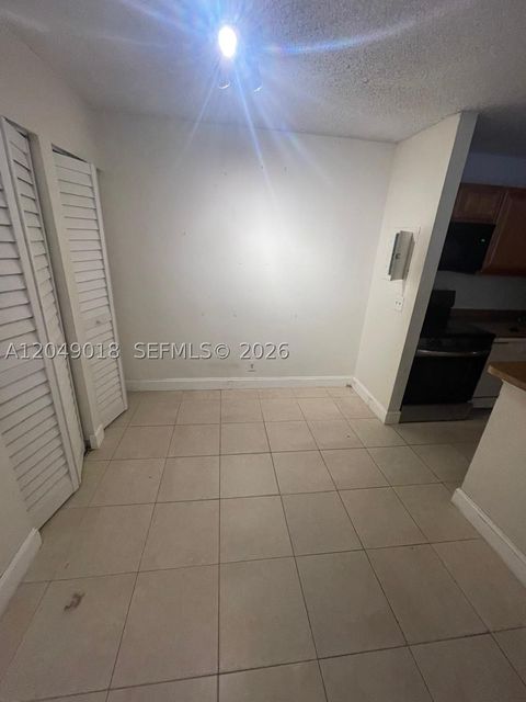 Photo of 10773 Cleary Blvd #103, Plantation, FL 33324 (MLS # A12049018)