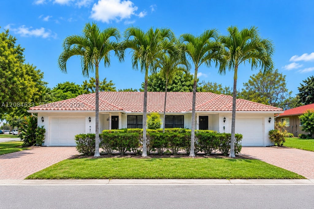 Photo of 1410-1412 NW 93rd Ter, Coral Springs, FL 33071 (MLS # A12084633)