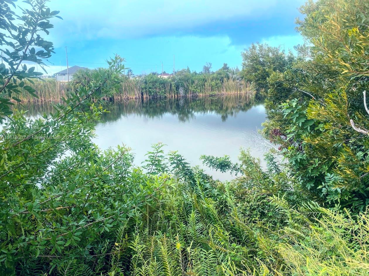 Build Your Future in Cape Coral! Discover this waterfront 0.24-acre lot in the heart of NW Cape Coral, offering endless potential to build your dream home. Bring your vision to life in one of the city’s fastest-growing neighborhoods. With no HOA restrictions, you can design your home exactly the way you want. Whether you’re planning a seasonal retreat, a year-round residence, or simply expanding your portfolio, this waterfront lot is a blank canvas for enjoying the warm, peaceful, and quiet lifestyle that Southwest Florida is known for.
And if you're considering other options or a package deal, I also have another waterfront vacant lot at 809 NW 29th Ave available For Sale—similar size and asking price.
