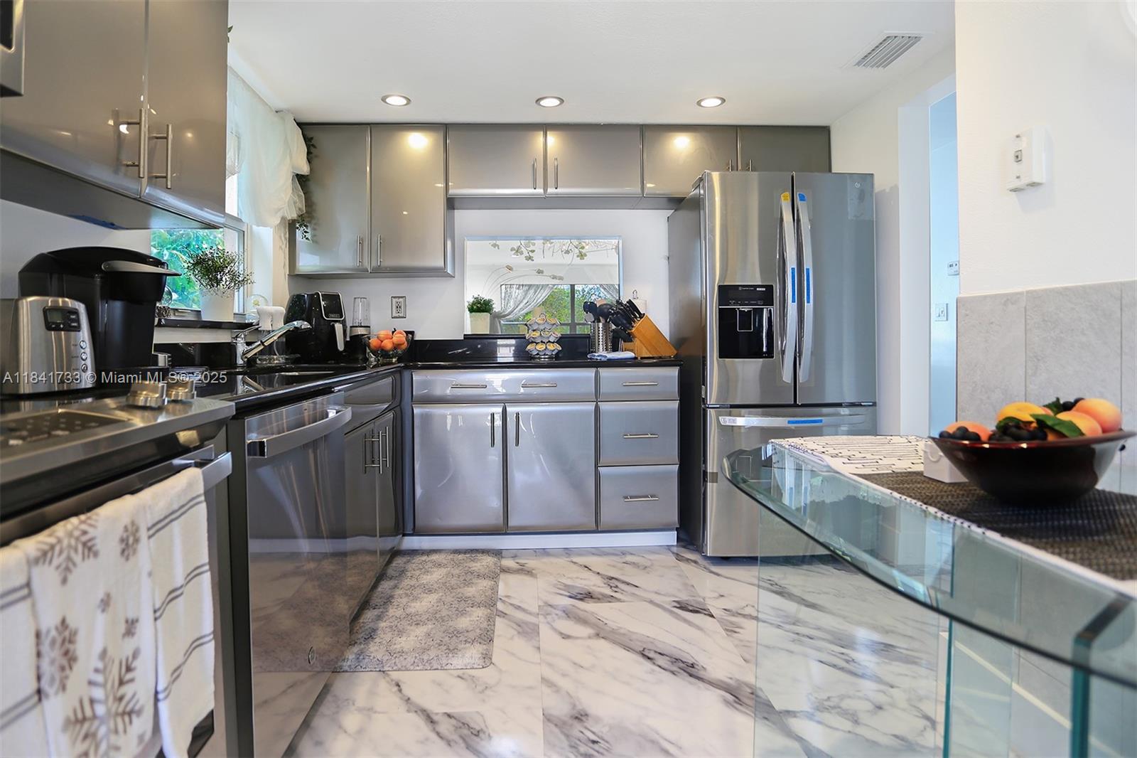 Dream Kitchen all stainless steel smart appliances and looks ultra modern New Refrigerator, and even has the stove and microwave with built in air fryer New led fans thru-out the unit Custom Custom bathrooms and has beautiful Real leather furniture,Plus it it has dishes , pot pans, silverware and plates. This is a Corner Unit with 2 private balconies penthouse like apartment Marble looking floors throughout has everything it is near shopping centers, hospital, close to the beach property it is in the center of everything location is perfect and very private impact windows throughout as well as Rolla dens in the patio areas this is what everyone wants.No condo approval is needed no age limit.