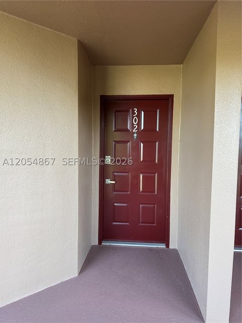 Photo of 500 SW 130th Ter #302A, Pembroke Pines, FL 33027 (MLS # A12054867)