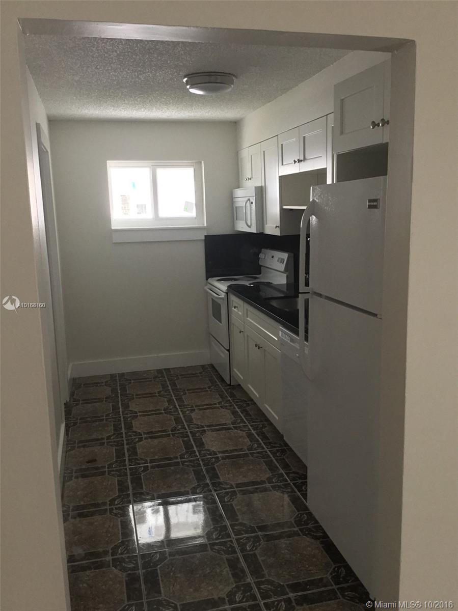 BEAUTIFUL RENOVATED SPACIOUS DUPLEX offering 2 Bedrooms and 1 Bathroom. This property has been totally Renovated with new TILE floors throughout, New Stove, Fridge, Dishwasher and Microwave and New Washer and Dryer, Backyard, Patio and the property is GATED. This is a must see. Ready for move in NOW!