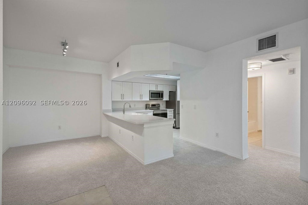 Photo of 3021 Alcazar Pl #305, Palm Beach Gardens, FL 33410 (MLS # A12096092)
