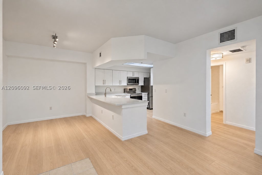 Photo of 3021 Alcazar Pl #305, Palm Beach Gardens, FL 33410 (MLS # A12096092)