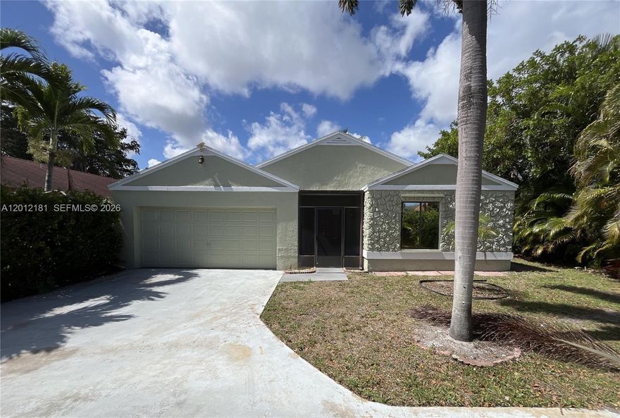 Affordable CBS home overlooking a lake from the back.  Covered patio for those lazy weekend days.  Features include a split floorplan with a private primary bedroom and bathroom that was updated earlier.  Other features include a 2 car garage, tile floors in living areas, laminate flooring in bedrooms, kitchen with granite countertops, solar system, and hurricane shutters.