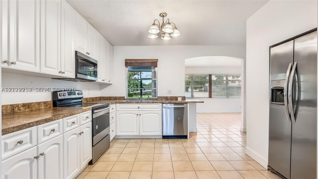 Photo of 500 NW 96th Ter, Pembroke Pines, FL 33024 (MLS # A12112253)