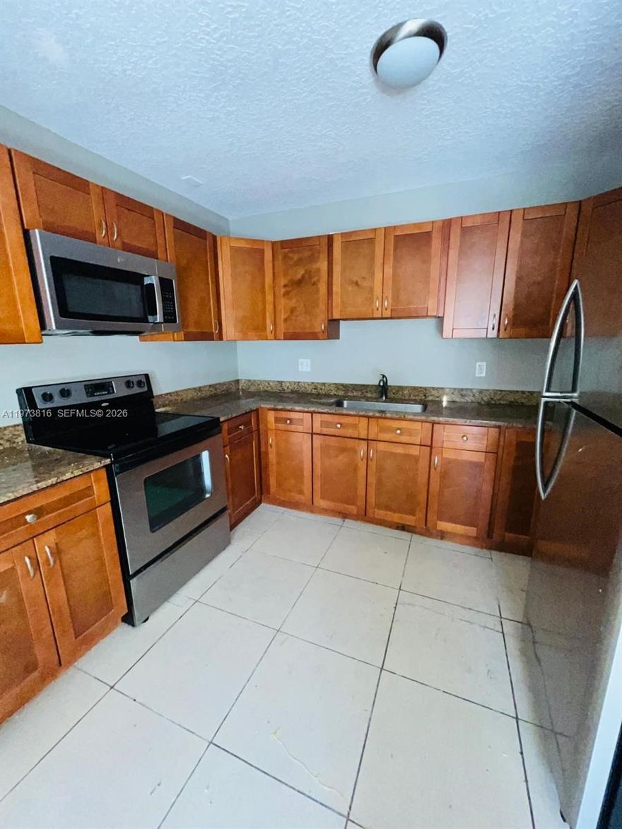 Discover the perfect rental home in a quiet neighborhood! This spacious 3-bedroom, 2-bathroom unit is located in a well-maintained fourplex and offers comfort, convenience, and easy living. Featuring tile flooring throughout, this home is ideal for low-maintenance living with a clean, modern feel. The open layout provides generous living and dining space, while large windows bring in plenty of natural light.

The primary bedroom includes ample closet space and a private bathroom. Two additional bedrooms are well-sized—perfect for a home office, guest room, or growing family. Central air conditioning keeps the home comfortable year-round.

Rent includes water, trash, and sewer—helping you save on monthly expenses. Enjoy an easy move-in process with fast application approval.

Conveniently located near top-rated schools, shopping centers, grocery stores, restaurants, parks, and public transportation. Quick access to major roads makes commuting simple.

If you're searching for a 3 bedroom rental, apartment for rent, pet-friendly rental (if applicable), or affordable housing in a prime location, this is the one.

Schedule your private showing today—this move-in ready rental won’t last long!