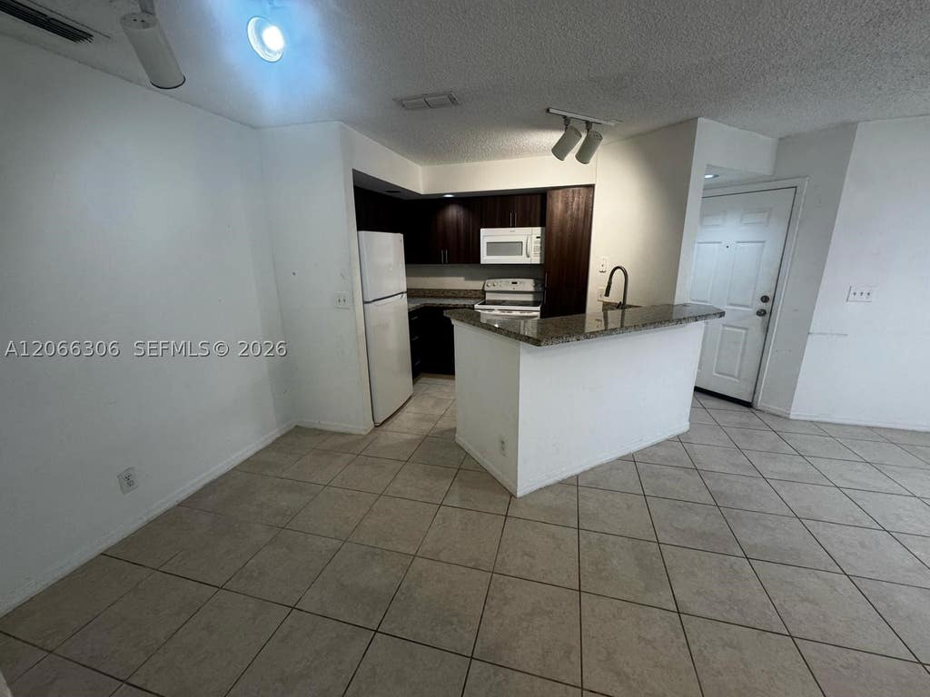 Photo of 3370 N Pinewalk Dr N #1213, Margate, FL 33063 (MLS # A12066306)
