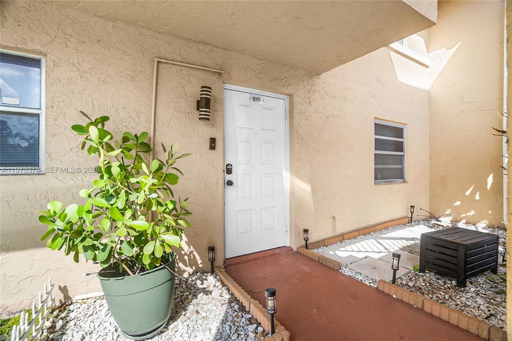 Photo of 879 Twin Lakes Dr #1-B, Coral Springs, FL 33071 (MLS # A11975378)