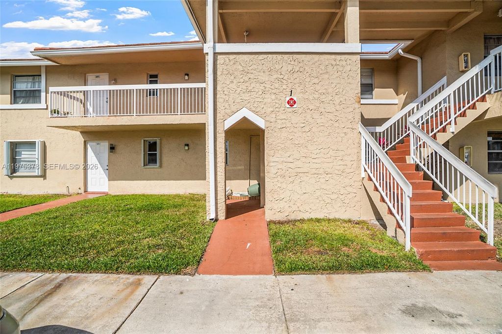 Photo of 879 Twin Lakes Dr #1-B, Coral Springs, FL 33071 (MLS # A11975378)