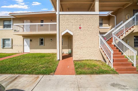 Photo of 879 Twin Lakes Dr #1-B, Coral Springs, FL 33071 (MLS # A11975378)