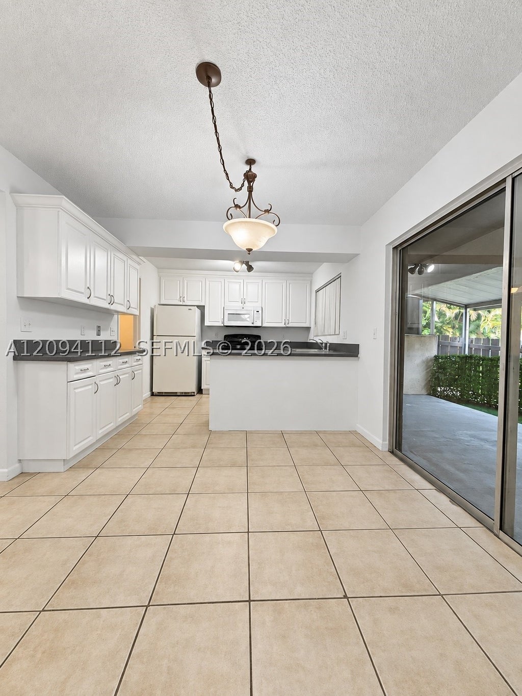 Photo of 5348 Bosque Ln #105, West Palm Beach, FL 33415 (MLS # A12094112)