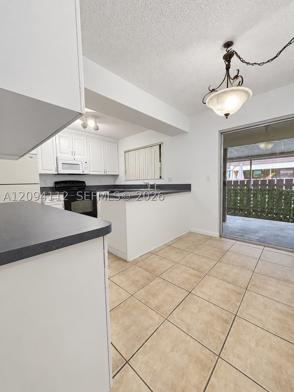 Photo of 5348 Bosque Ln #105, West Palm Beach, FL 33415 (MLS # A12094112)