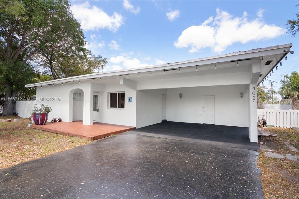 Set on an oversized, double lot with lush tropical landscaping, this one-of-a-kind home offers the perfect blend of privacy and luxury. This pool home features 3 spacious bedrooms with 3 ensuite bathrooms, all on one level for easy living. The open layout flows seamlessly into the kitchen with eat in bar counter top and stainless steel appliances. Step outside to your own private retreat—an open heated saltwater pool surrounded by a marble patio, ideal for relaxing or entertaining year-round. The fully fenced property ensures peace of mind while offering plenty of space to enjoy the outdoors in total seclusion.