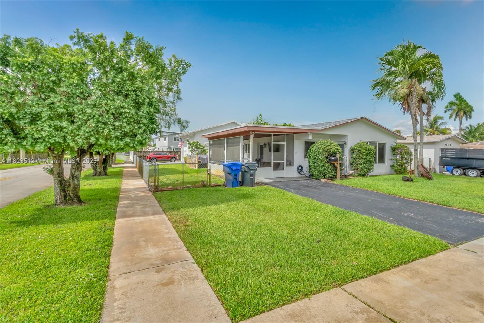 Charming 3-bedroom, 2-bath single-story home on a desirable corner lot! This well-kept residence features a screened-in front porch, private driveway, and huge detached garage with its own full bathroom—perfect for a workshop, guest suite, etc. Enjoy the lush landscaping and bright living space with large picture window that brings in natural light. Conveniently located near shops, dining, and short drive to Hollywood Beach. This home offers a unique combination of character, flexibility, and location—don’t miss this opportunity!