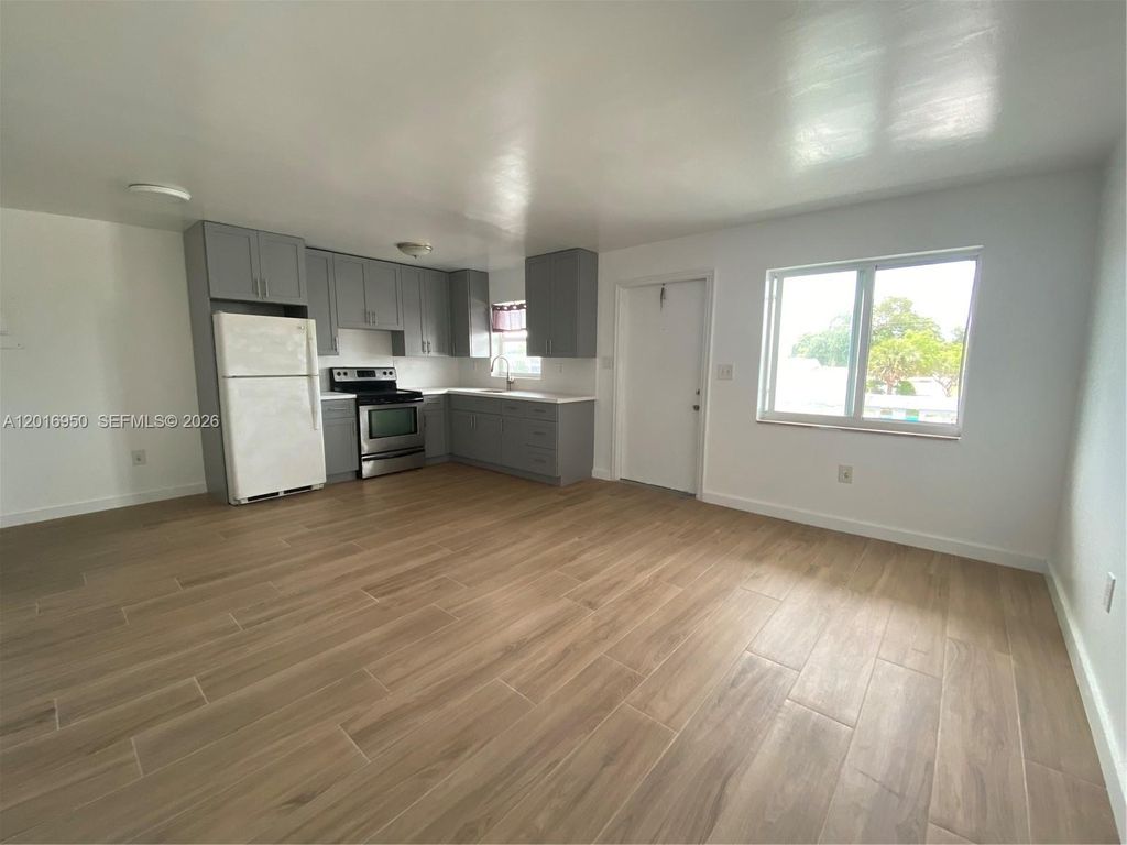 Photo of 7011 Pembroke Rd #202, Pembroke Pines, FL 33023 (MLS # A12016950)