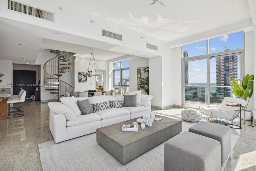 Aqua on Allison Island is 8.5 acres of urban luxury living at its finest. Developed by Craig Robins of Dacra, whose portfolio includes the Miami Design District, Design Miami and developments within Sobe’s Art Deco District. A community of TH + 3 mid rise condo buildings built in collaboration with Architects Walter Chatham, Alex Gorlin and Alison Spear. This 2 story PH unit in the Chatham building offers 2 beds, 4.5 baths, a spacious kitchen with oversized island, great for entertaining. The wraparound terrace off the Living Room boasts stunning views of the Ocean, Intracoastal, Golf Course and Downtown. Upstairs, kitchenette and full bath leading onto 2,500 sq ft of private roof terrace. Two assigned parking spaces with the use of a third.