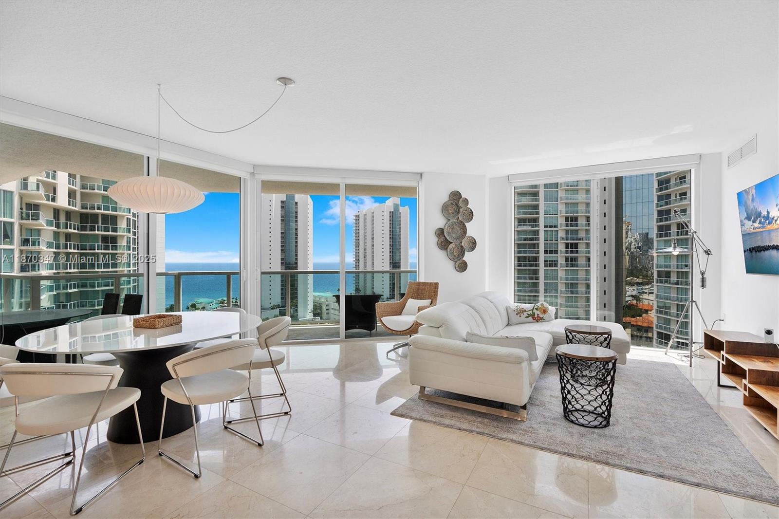 Best line in the building — fully furnished with spectacular views of the city, ocean, and Intracoastal from a high floor. This elegant residence features marble and wood flooring throughout, custom blinds and curtains, a modern kitchen with stainless steel appliances, and a spacious master suite with a walk-in closet.Enjoy resort-style amenities including multiple pools, state-of-the-art fitness centers, and jacuzzis. Perfectly located within walking distance to the beach, and just minutes from Bal Harbour Shops, Aventura Mall, fine dining, and top-rated schools.