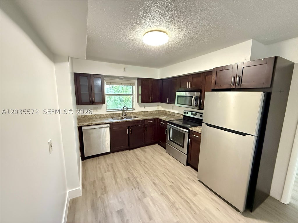 Photo of 1406 SW 1st ST #A, Fort Lauderdale, FL 33312 (MLS # A12035572)