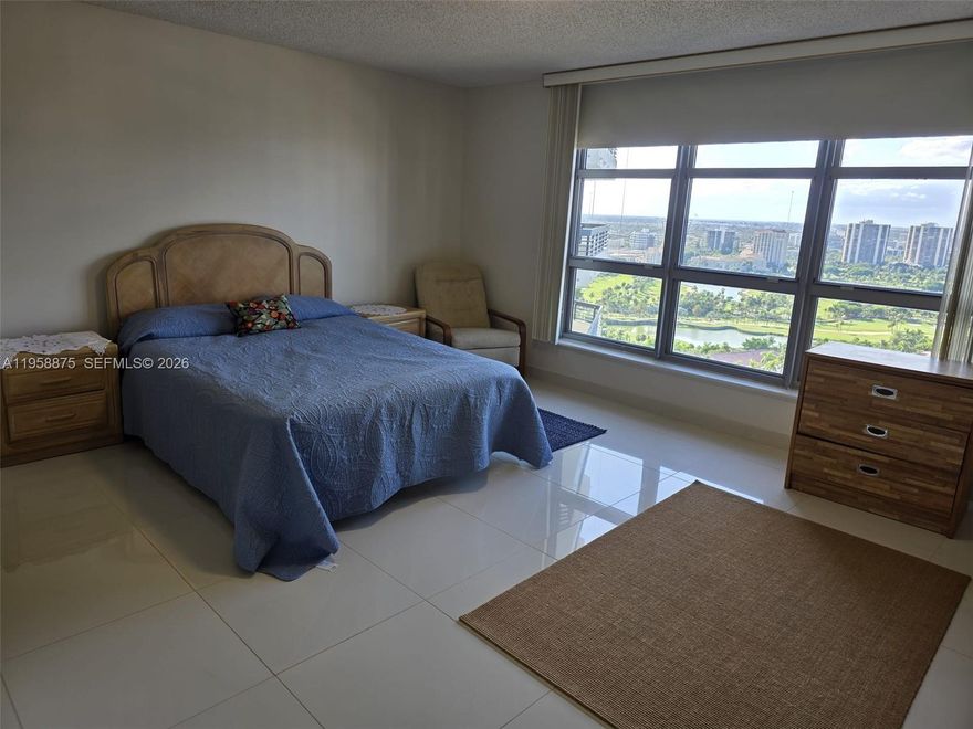 Enjoy expansive, panoramic views from this spacious, corner residence. The split floor plan offers privacy and a desirable, larger 2-bedroom, 2-bath plus den layout. The kitchen features stainless steel appliances, and the air conditioning system was replaced in 2023. There is a washer and dryer in the unit, modern ceramic floors, and a wrap-around balcony.
Mystic Pointe offers resort-style amenities, including 24-hour security, a state-of-the-art fitness center, tennis and pickleball courts, a playground, sauna, and dog park, valet parking, shuttle to Aventura Mall, a pet-friendly gated community. Ideally located just minutes from Aventura Mall, beaches, golf courses, and top-rated A+ schools.