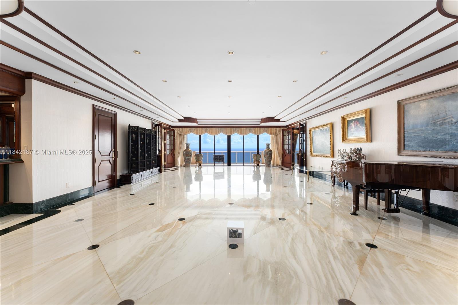Create your dream penthouse in the sky, an oceanfront opportunity with breathtaking views & endless potential. Welcome to PH4 at L’Excellence a well-maintained resort-style property. This rare 4-bed, 6-bath penthouse offers expansive open living spaces, marble flooring, a wraparound balcony, & direct ocean view. The layout is designed for both grand entertaining & effortless coastal living. Features include an open-concept kitchen, formal dining area, spa-inspired primary bath, & generous walk-in closets Enter through your exclusive elevator foyer and ascend to a rooftop Florida room designed for a personalized garden escape. 12 parking spaces, 3 private cabanas, & exclusive beach access. This full-service building offers 2 pools, 2 fitness centers, playroom, & card room.