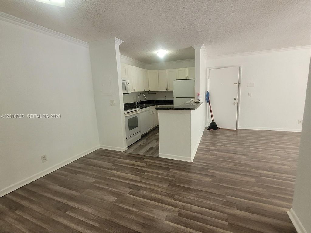 Photo of 10773 Cleary Blvd #203, Plantation, FL 33324 (MLS # A12018926)