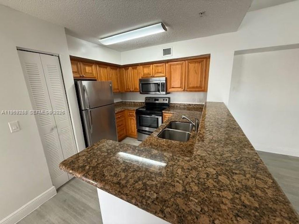 Photo of 12112 Saint Andrews Pl #303, Miramar, FL 33025 (MLS # A11959288)