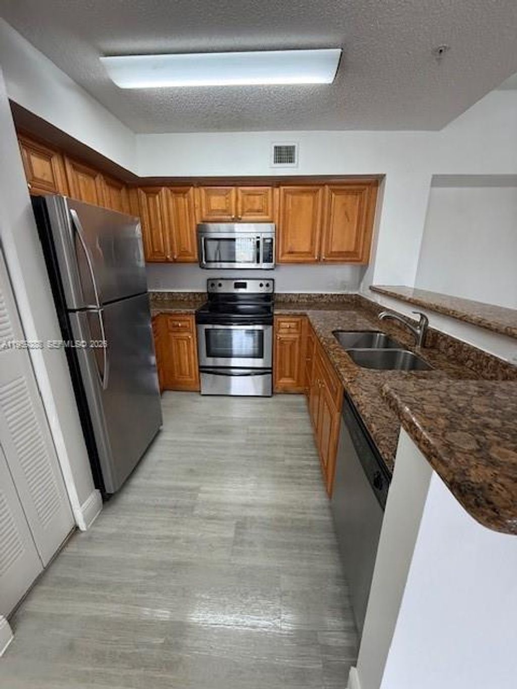 Photo of 12112 Saint Andrews Pl #303, Miramar, FL 33025 (MLS # A11959288)