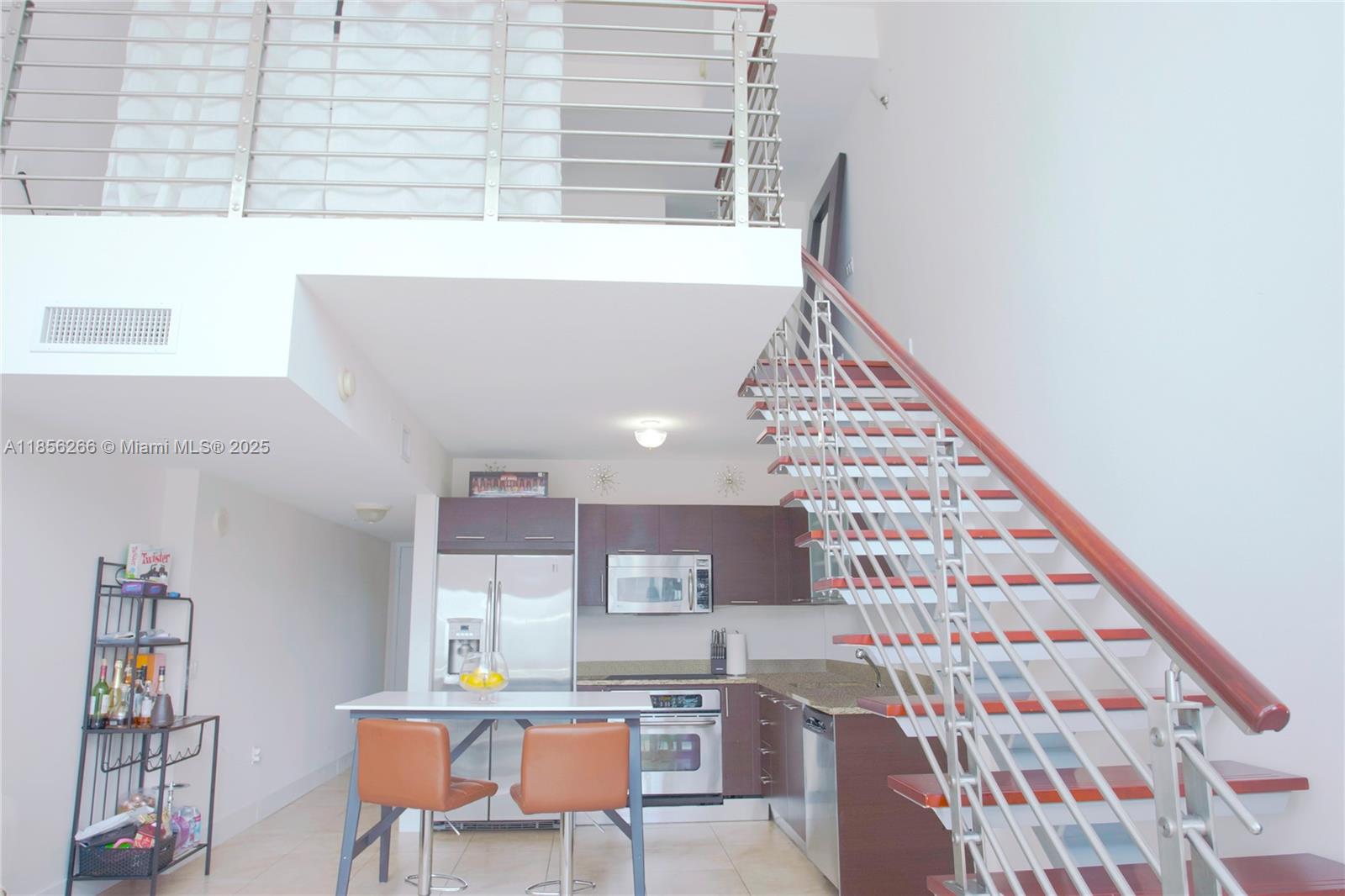 Modern 1-Bedroom, 1.5-Bath Loft at Brickell on the River South – double-height windows, open kitchen with stainless steel appliances, granite countertops, and European cabinetry. Upstairs primary suite with walk-in closet and en-suite bath. Washer/dryer and assigned parking included. Full-service building with 24-hour concierge, valet, pools, spa, fitness center, and business lounge. Prime riverfront location steps from Brickell City Centre, Metromover, dining, and shopping.