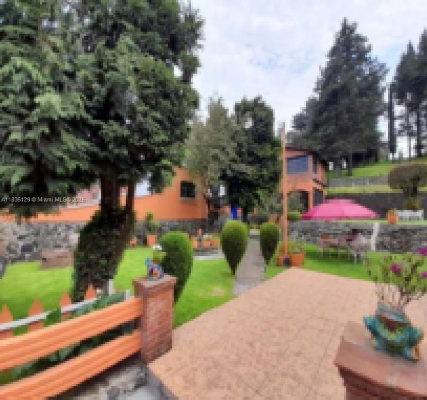 Rancho "Los Duraznos" | Km 31 Carretera Federal to Cuernavaca San Miguel Topilejo, Tlalpan Borough, Mexico City, C.P. 014500 | Land Size: Approx. 46,600 m² (11.5 acres / 501,600 sq ft | Property Features - Two Rustic-Style Homes: - Main Cabin (~200 m² / 2,153 sq ft): Features three bedrooms, two full bathrooms, living room with fireplace, dining area, fully equipped kitchen with built-in cabinetry and pantry, stationary gas supply, and two water heaters. - Second Cabin (~150 m² / 1,615 sq ft): Includes two bedrooms, two full bathrooms, a living room, and a dining area. Additional Living Quarters: - Stable caretaker’s room with full bathroom - Outbuildings & Agricultural Facilities: - Two-story bungalow