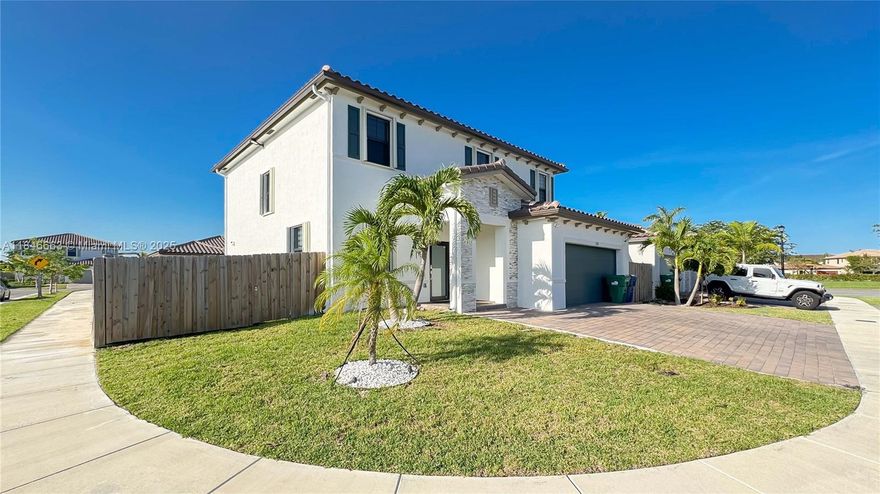 Excellent opportunity to buy!  5-bedroom, 3-bath corner residence, offering elegant design and generous space at exceptional value. Bathed in natural light, the home features newly installed porcelain tile flooring, a bright open-concept kitchen, and two expansive living areas ideal for relaxed family living. The oversized, fenced backyard provides the perfect setting for outdoor enjoyment. Custom closets in every bedroom, and a laundry room with sleek cabinetry. High impact doors, accordion shutters and impact windows.  The garage boasts epoxy flooring and thoughtful organization. A premium security system is already in place, water filtration system whole house. Amazing clubhouse and security patrol. This is truly a rare find in today’s market. Schedule your private showing today!