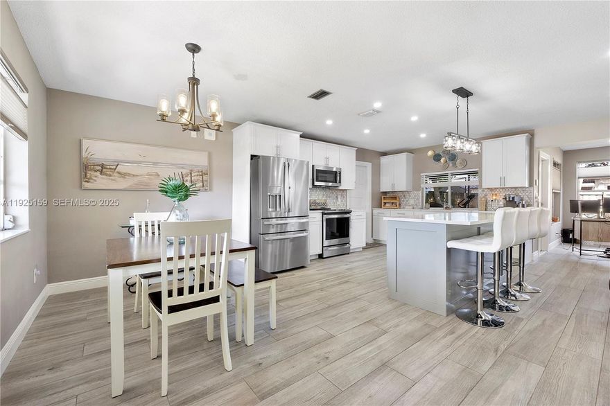 Priced to sell! This stunning, turn-key single-family home with garage in the heart of Pembroke Pines has been beautifully updated and is ready for you to move right in and enjoy. From the moment you step inside, you'll love the bright open-concept layout, custom shaker style doors and sleek tile flooring throughout, a modern kitchen featuring GE Profile Series Stainless Steel Appliances and Quartz countertops. This meticulously maintained home is packed with upgrades, including a top-of-the-line washer & dryer, new AC, tankless water heater, updated bathrooms, Bali custom window blinds, full accordion hurricane shutters, and a covered, screened-in patio perfect for relaxing or entertaining. The well-fed sprinkler system keeps your lawn lush with ease, and with NO HOA, you’ll enjoy maximum freedom and flexibility. Located in a highly desirable, family-oriented community, you’re just steps from public and charter schools, Pembroke Lakes Mall, CB Smith Park, two dog parks, and countless dining options. Plus, you’re just minutes from major highways, colleges, places of worship, and even the beach. This is the South Florida lifestyle at its best, don’t miss it!