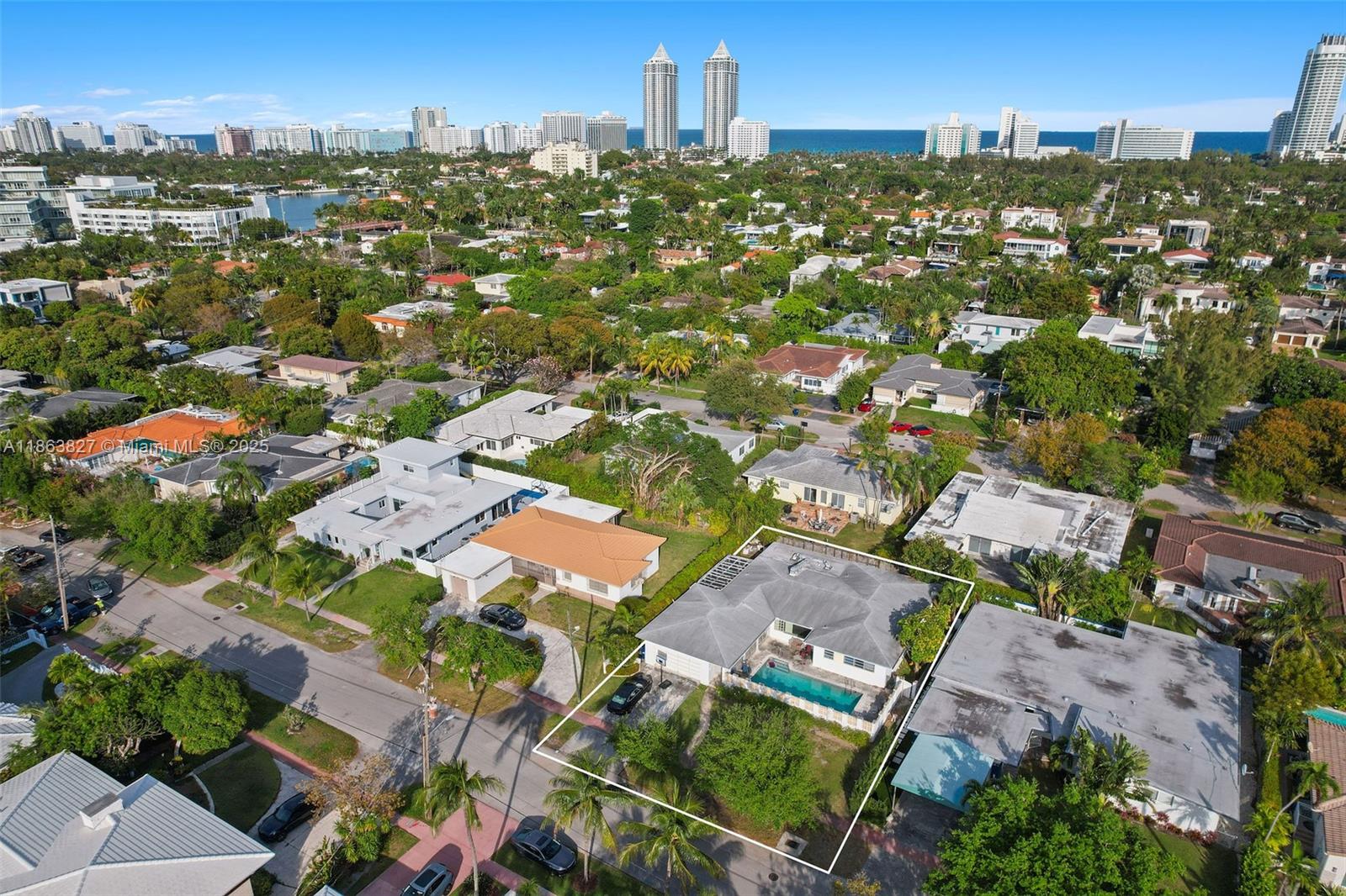 Discover this prime opportunity to build your dream home on an 8,929 SF lot in Miami Beach’s sought-after Mid Beach area, with fully approved plans in place. The proposed 4,464 SF luxury residence features 6 spacious bedrooms, 6.5 bathrooms, a high-end Italian kitchen, and opulent marble bathrooms with steam showers. The design includes a 2-car garage, while unique architectural elements shape the home’s exterior design, complemented by a covered patio and heated saltwater pool for year-round outdoor enjoyment. Situated near top schools, pristine beaches, and the vibrant shops and dining of 41st Street, this property offers the perfect setting for creating a bespoke residence in one of Miami Beach’s most desirable neighborhoods.
