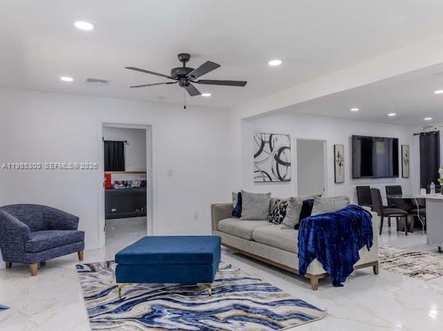 COME AND FALL IN LOVE WITH THIS FULLY RENOVATED LUXURY HOME, FEATURING 3 BEDROOMS 3 FULL BATHROOMS, WITH TWO PRIMARY SUITES, A PRIVATE ENTRY SUITE IDEAL FOR MULTI-GENERATIONAL LIVING OR INCOME POTENTIAL. SHOWCASING POCELAIN FLOORING THROUGHOUT, A MODERN KITCHEN WITH A LARGE ISLAND AND AN OPEN CONCEPT LAYOUT DESIGNED FOR COMFORT AND STYLE. NEW ROOF, NEW A/C UNIT, IMPACT WINDOWS AND DOORS FOR ENHANCED SECURITY AND ENERGY EFFICIENCY. MOVE-IN READY AND THOUGHTFULLY DESIGNED WITH PREMIUM FINISHES, OFFERING A RARE BLEND OF FLEXIBILITY, FUNCTIONALITY WITH MODERN LIVING.