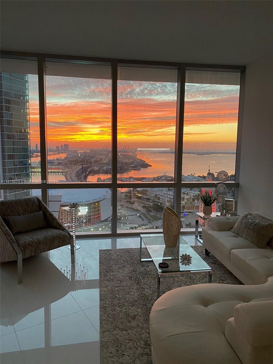 $1,299,000 unfurnished or $1,325,000 furnished w/ 100k in DESIGNER FURNISHINGS, Both Prices include a LARGE STORAGE UNIT ON THE SECOND FLOOR. Stunning Ocean and Skyline views! Move right in-decorator furnishings negotiable! Garage parking + 2 valet spaces. Considered one of the most amenity-rich buildings in the world, this 29th floor condo features luxurious finishes, and floor to ceiling windows. Elevator opens to your private foyer, split bedrooms with ensuite baths plus guest bath. Quartz waterfall kitchen island, Bosch & Subzero, Italian cabinetry. Generous master suite w/spa-like bathroom; soaking tub and walk-in shower. Enjoy the resort style pool w/cabanas, fitness room, movie theater, recording studio, golf simulator, soccer field, indoor basketball, multiple rooftop pools.