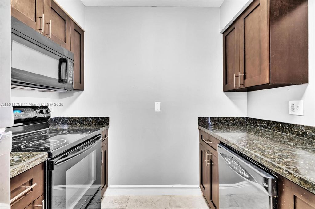 Photo of 2820 N Oakland Forest Dr #208, Oakland Park, FL 33309 (MLS # A11911796)