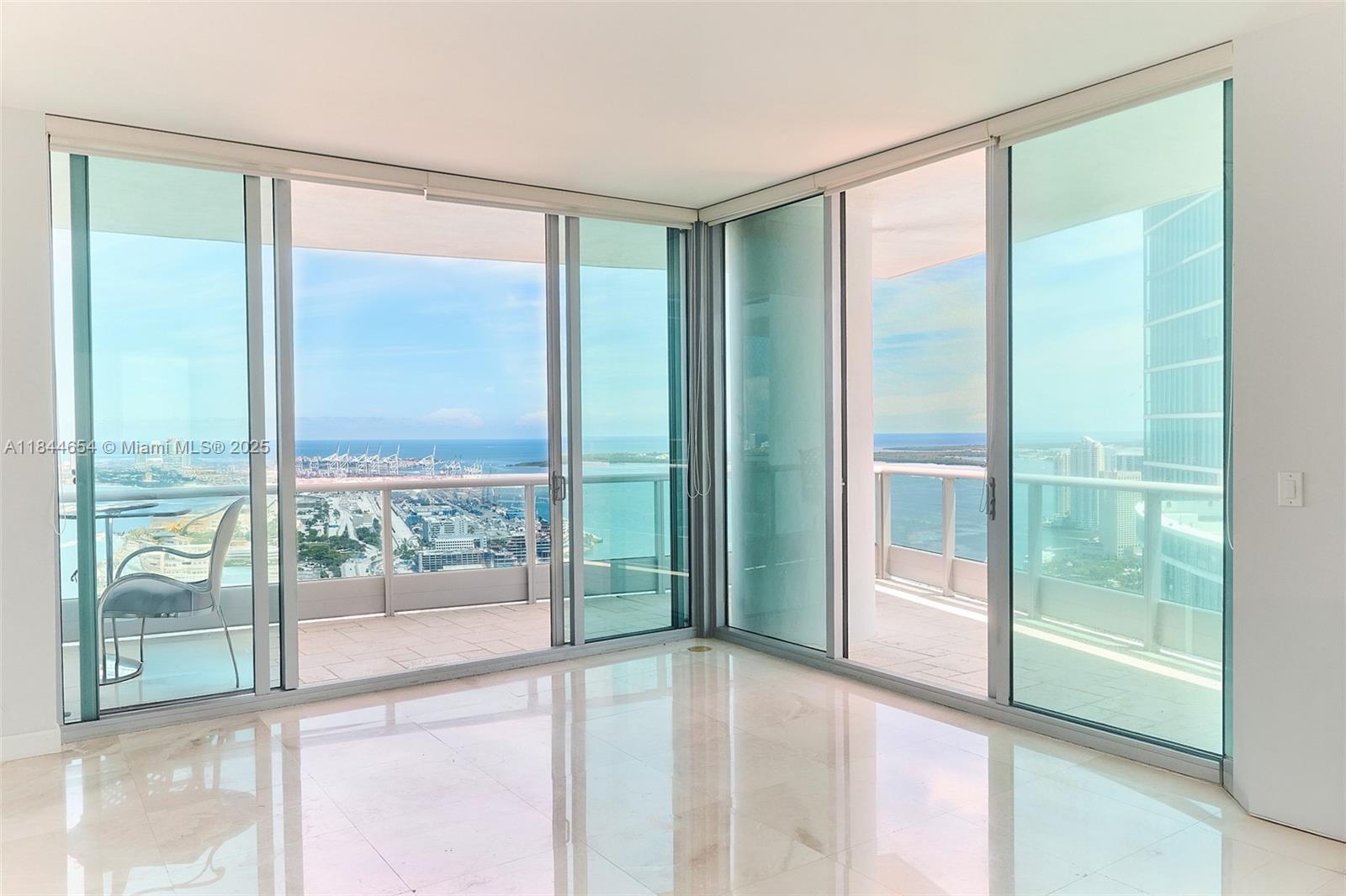 |Unit Being Refreshed| – Be the First to Live in the New Look at 900 Biscayne!
Soaring above the city, this stunning 56th-floor corner unit offers 2 bedrooms, 3.5 baths, and sweeping views of Biscayne Bay and the Miami skyline from expansive wraparound terraces. Enjoy a private elevator lobby opening into your foyer, a spacious layout with floor-to-ceiling glass, marble floors, a modern kitchen with granite countertops and stainless steel appliances, in-unit laundry, and assigned parking.
Resort-style amenities include gym, spa, private theater, game room, BBQ area, and a newly renovated pool deck with two pools, perfect for both relaxation and entertaining. 24-hour concierge and security, valet service, and a prime downtown location near shops, dining, and cultural attractions.