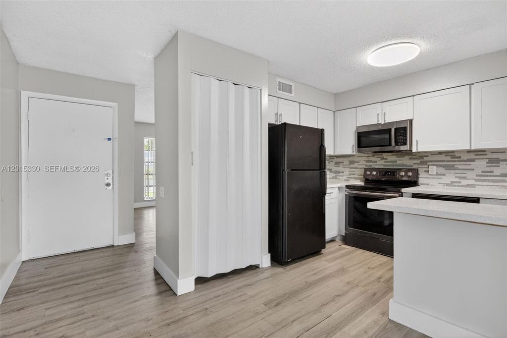 Photo of 4409 Treehouse Ln #F, Tamarac, FL 33319 (MLS # A12015330)