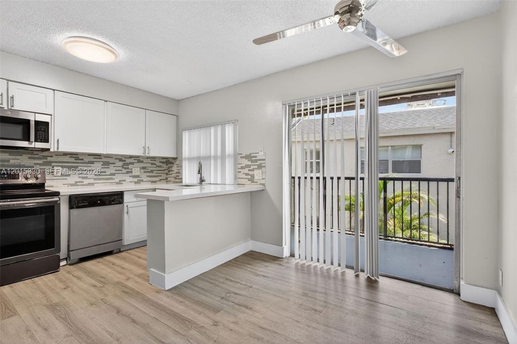 Photo of 4409 Treehouse Ln #F, Tamarac, FL 33319 (MLS # A12015330)
