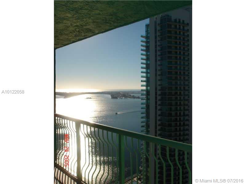 1/1 Rental available immediately. Rent includes hot water, basic cable, basic internet & one parking space. Unit has wood floors, an oversized tiled balcony with bay views + city views from a high floor, and two "California closets" plus stainless steel appliances. NO PETS! Easy and fast condo approval. Building has a full sized new gym, front desk, security, two lap pools and a Jacuzzi. Best location in Brickell! Walking distance to Metrorail, Mary Brickell Village, Publix, shops. Vacant & easy to show!