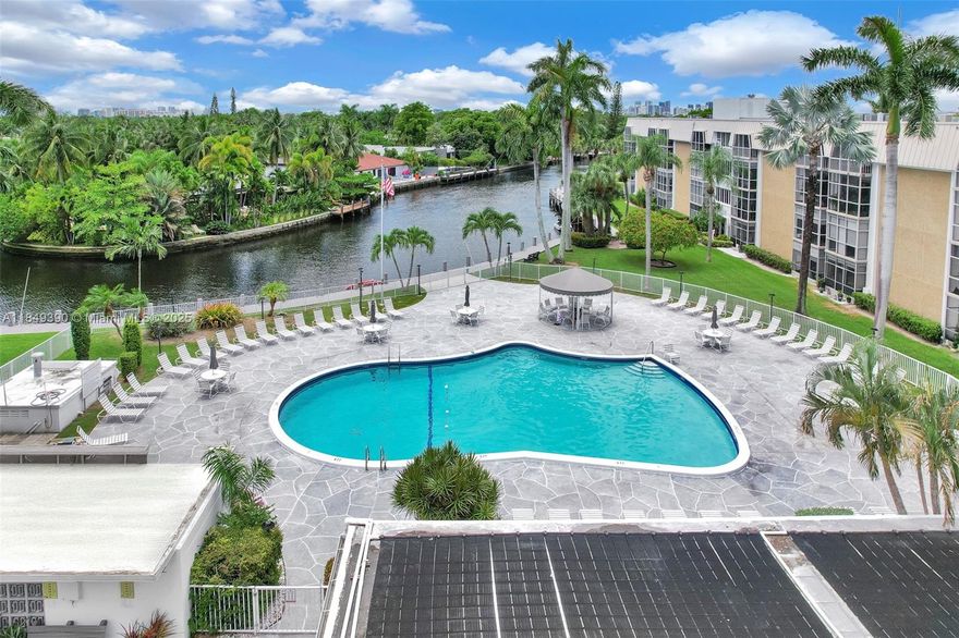Move-in ready 2BD/2BA condo in gated River Terrace. Just 1 mile from the beach and minutes to Wilton Manors, Oakland Park Arts District, Las Olas, and Downtown Fort Lauderdale. Enjoy canal views and a safe, walkable neighborhood with direct water access for kayaking and paddleboarding. This light-filled unit features a spacious layout and serene setting. Community amenities include a heated canal-front pool, fitness center with sauna, tennis, pickleball, shuffleboard, pool table, event room, outdoor grill, and boat dock. Ideal for full-time living or a vacation escape—schedule a showing today!