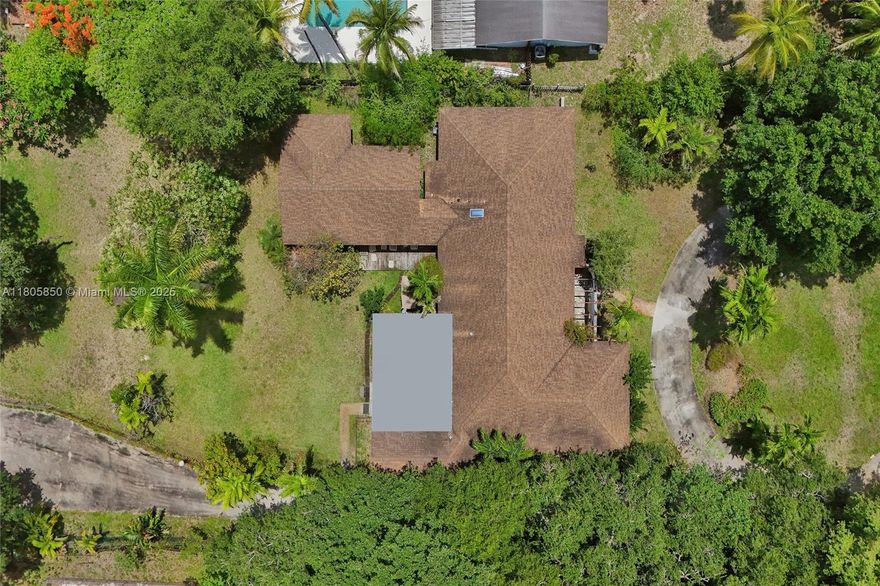 Custom-Built 7BR/4BA Estate on 34,048+ SF Lot! This private compound features 6,035+ SF of total sqft , soaring ceilings, and oversized bedrooms. Main house includes a 2-car garage, while the detached guest house offers its own 2-car garage, private bedroom, full bath, and living room—ideal for extended family or guests. Gated entry, lush mature landscaping, and plenty of space for RVs, boats, or multiple vehicles. Rare opportunity just 10 mins from the beach and close to top shopping, airports & highways.