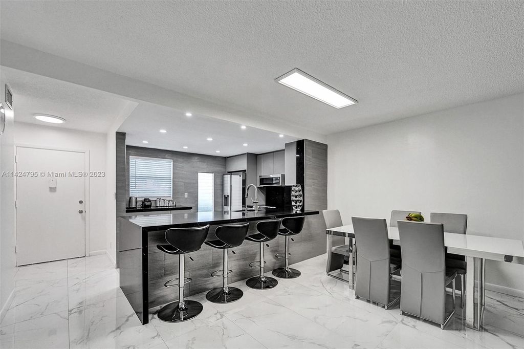 Photo of 320 NE 12th Ave #102, Hallandale Beach, FL 33009 (MLS # A11424795)