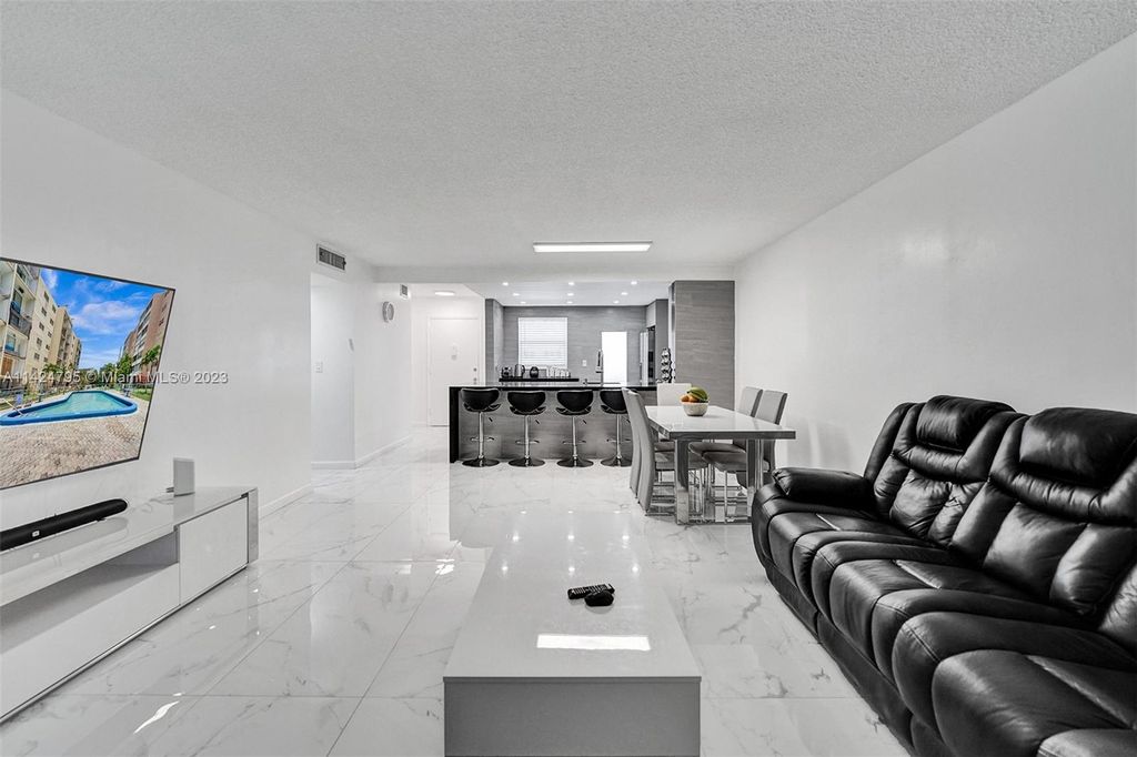 Photo of 320 NE 12th Ave #102, Hallandale Beach, FL 33009 (MLS # A11424795)