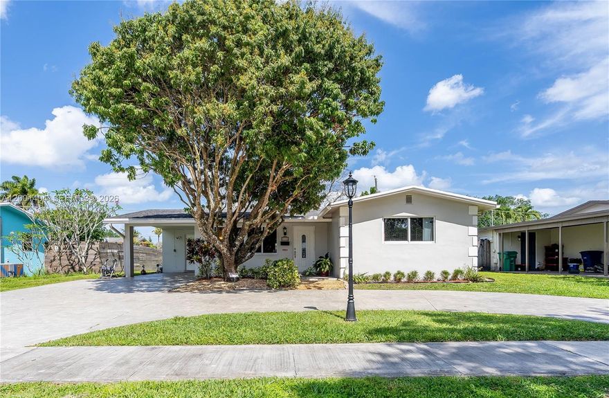 This nicely updated home is located in a quiet residential neighborhood in central Cooper City. Close to two Publix, three Walmart, and Target, as well as several parks. the home is also within walking distance of A-rated public schools.The re-finished circular driveway (2025) and carport offer plenty of parking for residents, while the 2017 roof has many years of service remaining. New sprinkler pump and control panel (2026). In addition, the impact windows throughout the home offer added peace of mind during hurricane season.New laminate wood floors (2026) in the main living areas, fresh carpets in the bedrooms and updated bathrooms complete the appeal of this home. Best of all there is no HOA!
